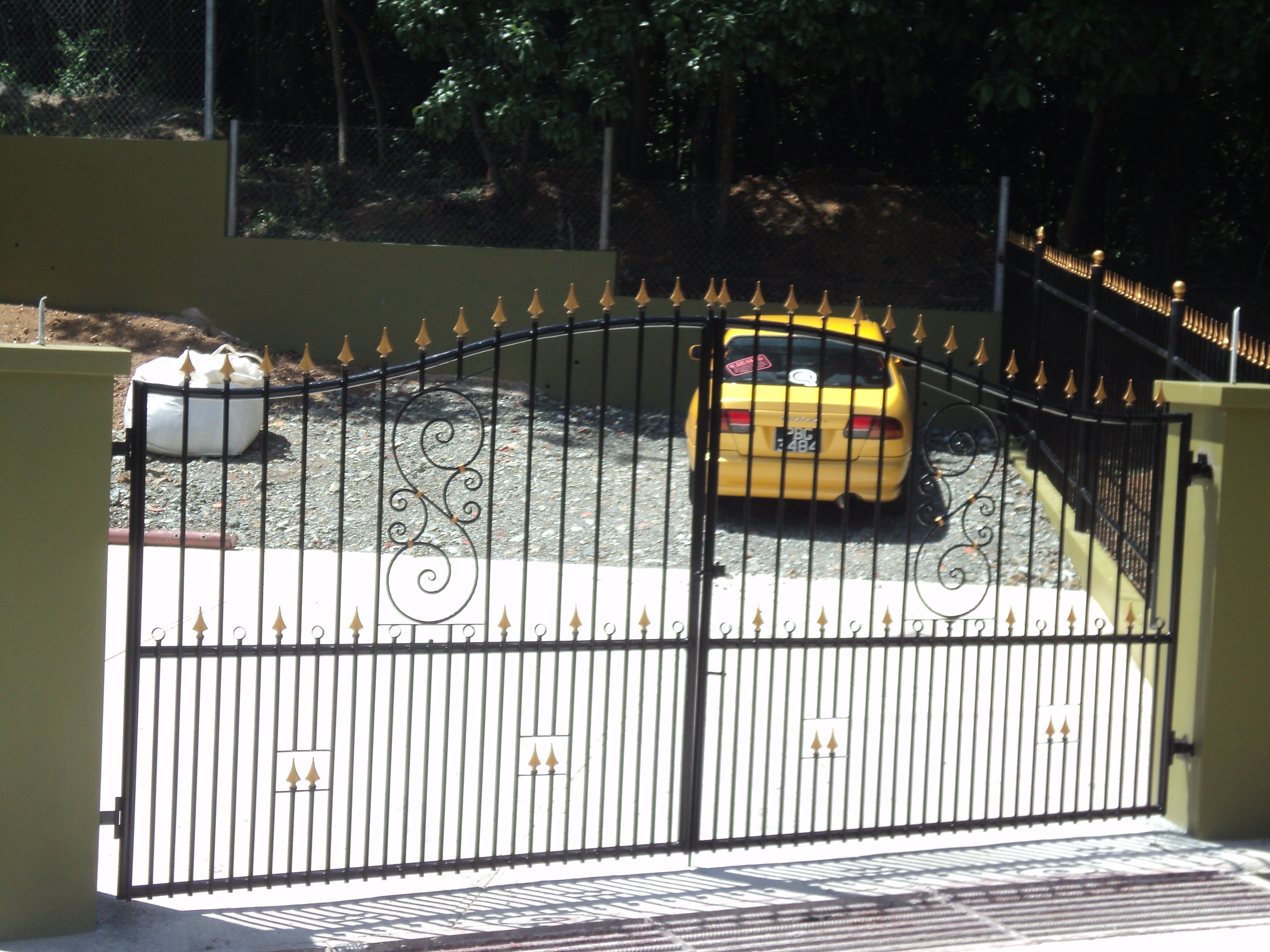 Custom fabricated gate with ornate metalwork